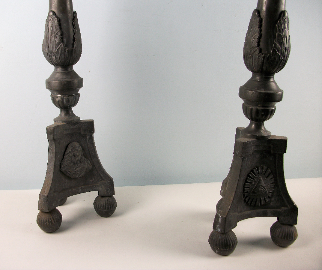 a pair of pewter candlesticks